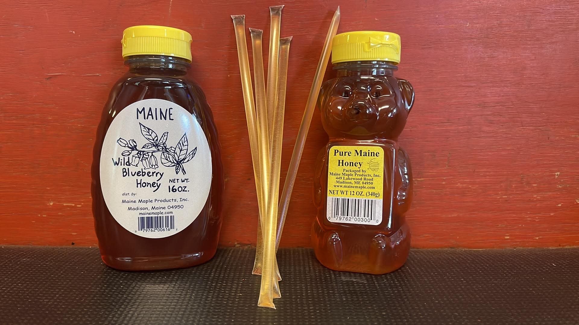 Maine Wild Blueberry Honey and Pure Maine Honey bear bottle with honey sticks